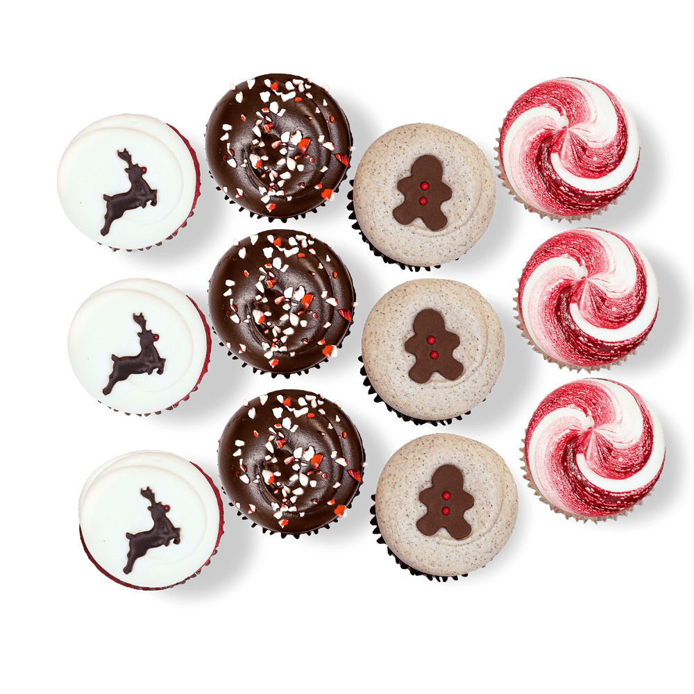 Holiday cupcakes with reindeer, gingerbread, and peppermint decorations