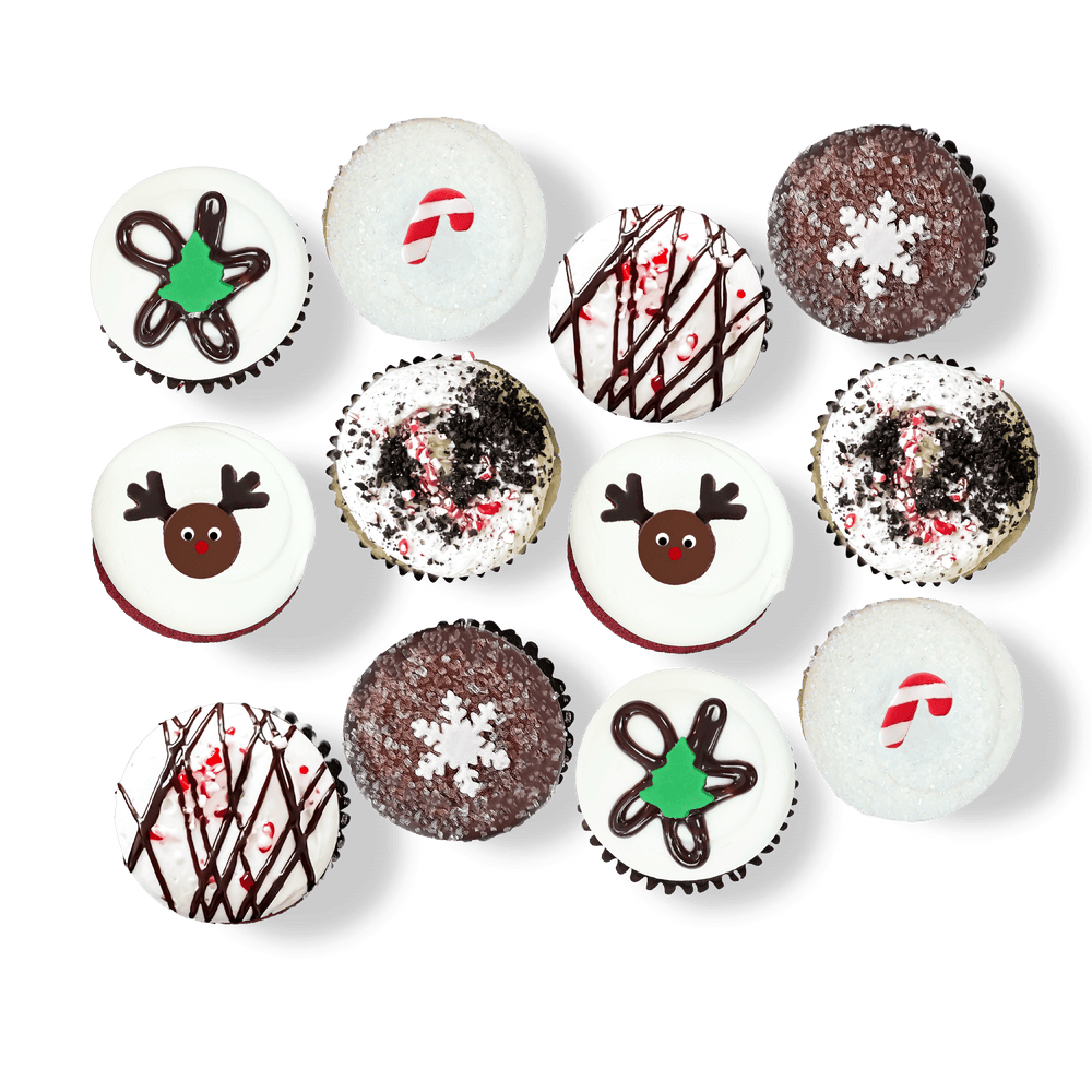Holiday cupcakes with reindeer, candy cane, and snowflake decorations