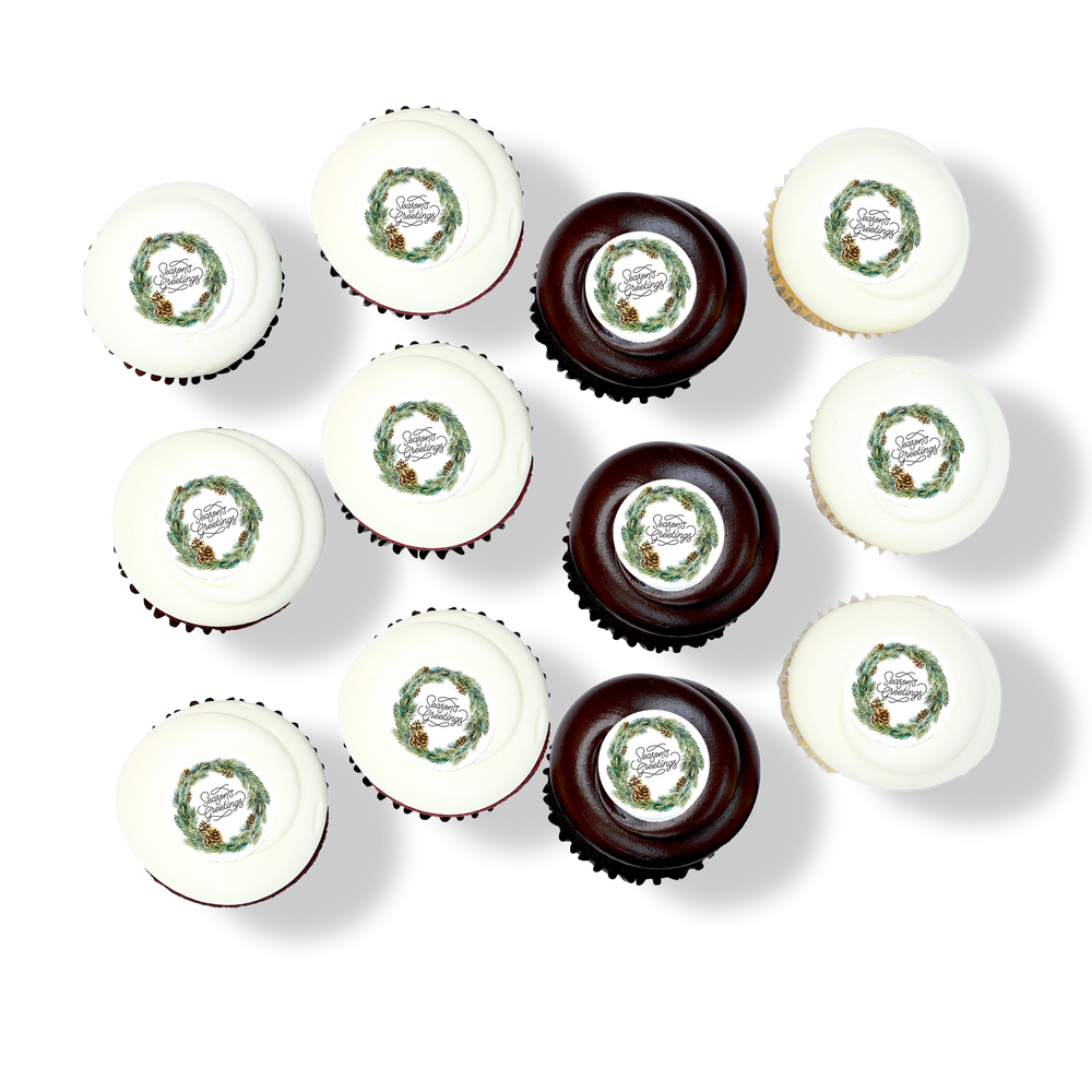 Holiday cupcakes with wreath and “Season’s Greetings” toppers