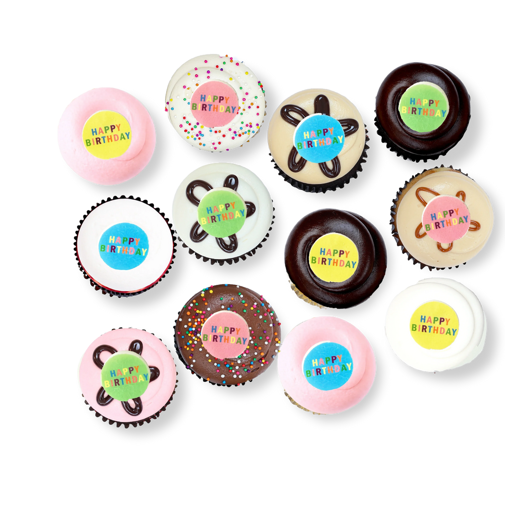 Birthday cupcakes with colorful “Happy Birthday” toppers