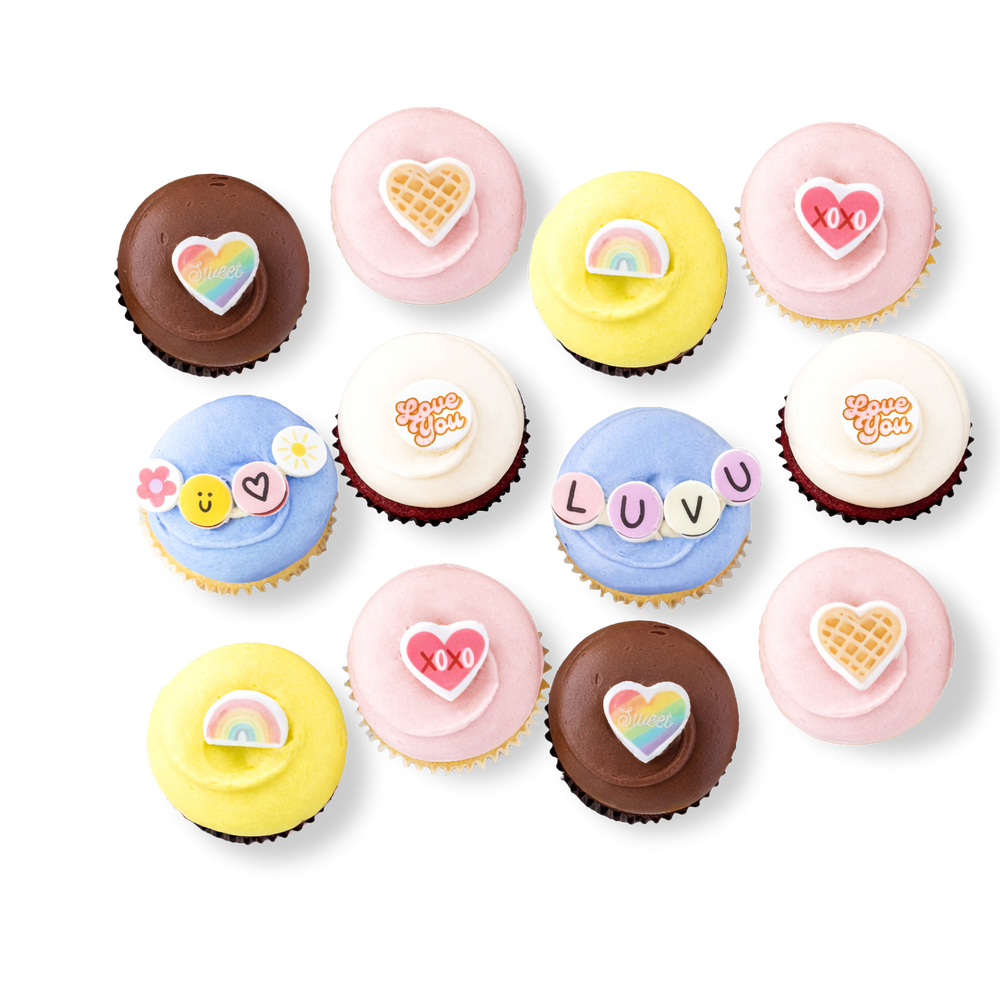Valentine cupcakes with hearts, rainbow, and friendship bracelet designs