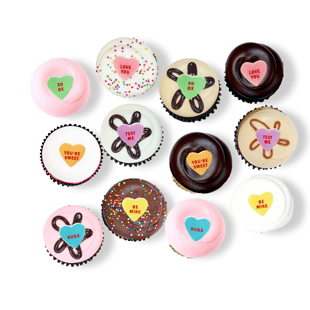 Cupcakes with pastel frosting and Valentine heart messages