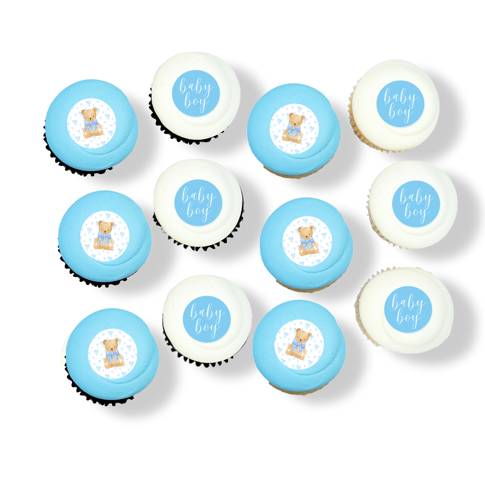Baby boy cupcakes with blue and white frosting and teddy bear toppers