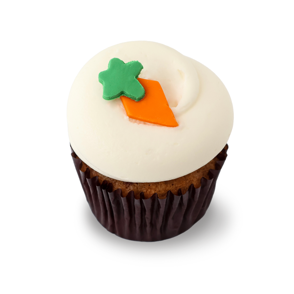 Carrot cake cupcake with cream cheese frosting and carrot