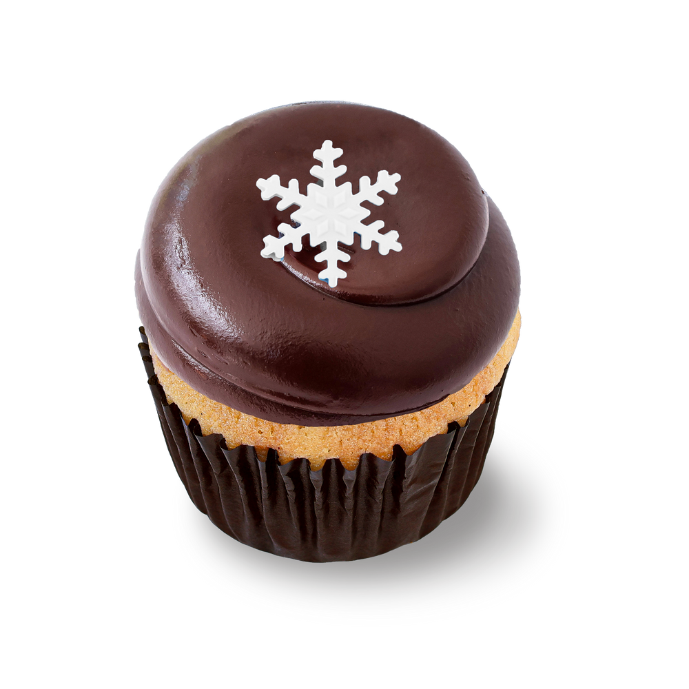 Vanilla cupcake with chocolate chips, frosting, and snowflake topper
