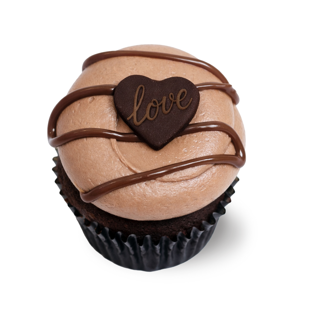 Chocolate cupcake with hazelnut frosting and “love” heart topper