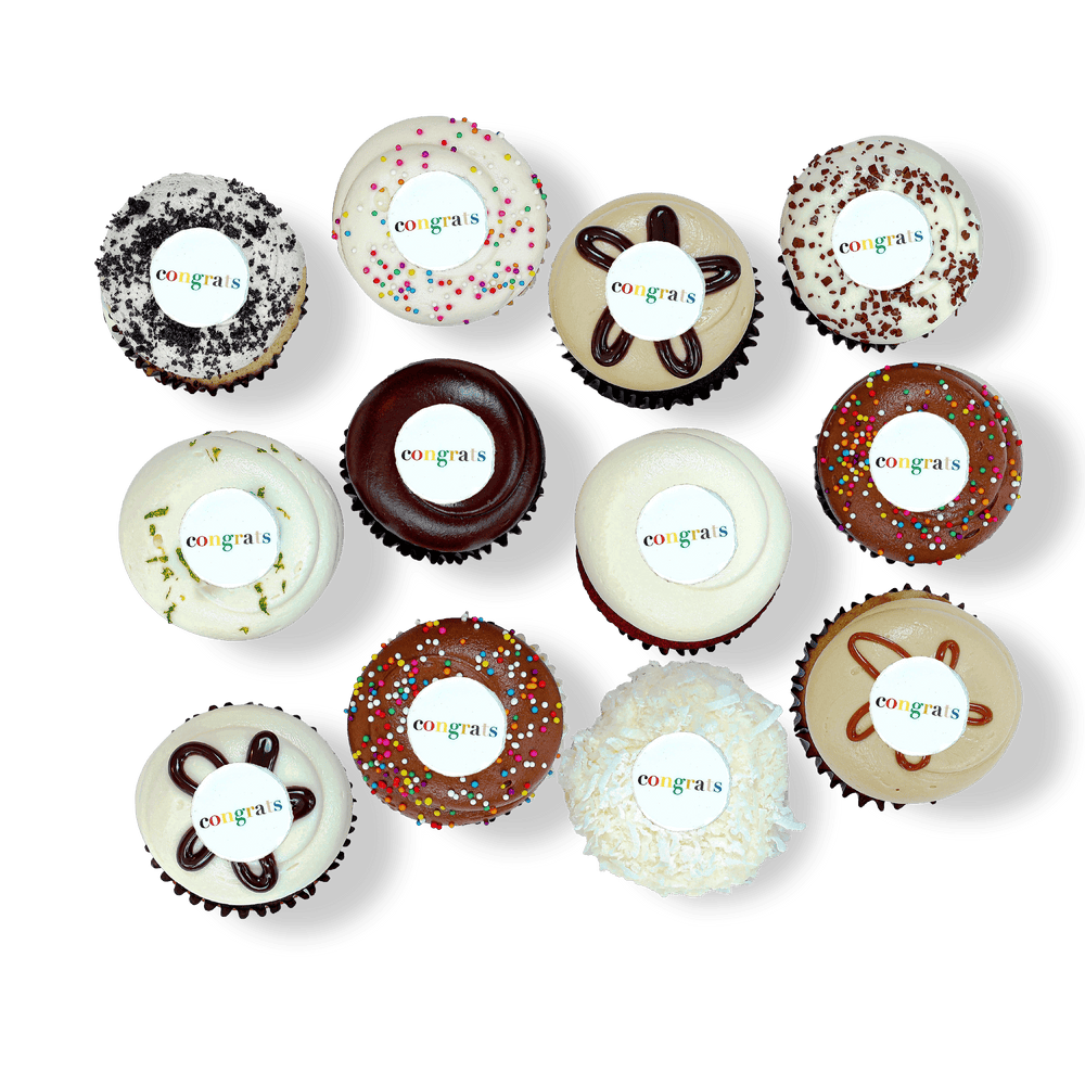 Cupcakes with colorful “Congrats” toppers