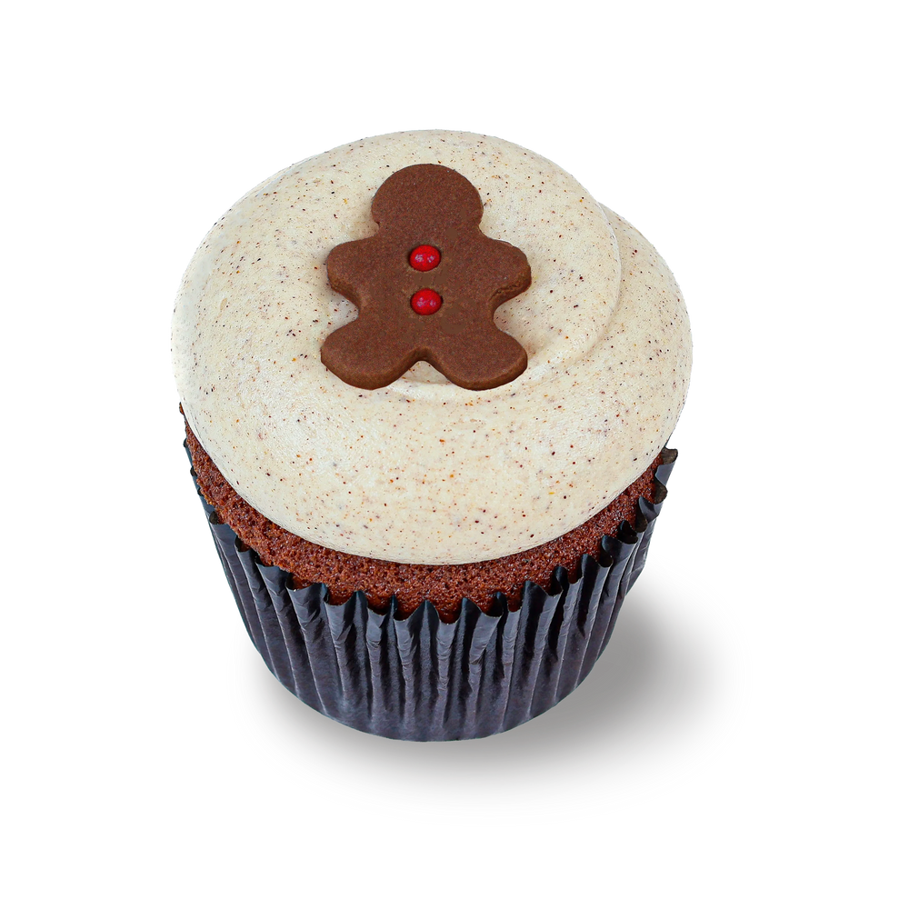 Gingerbread cupcake with cinnamon frosting and gingerbread topper