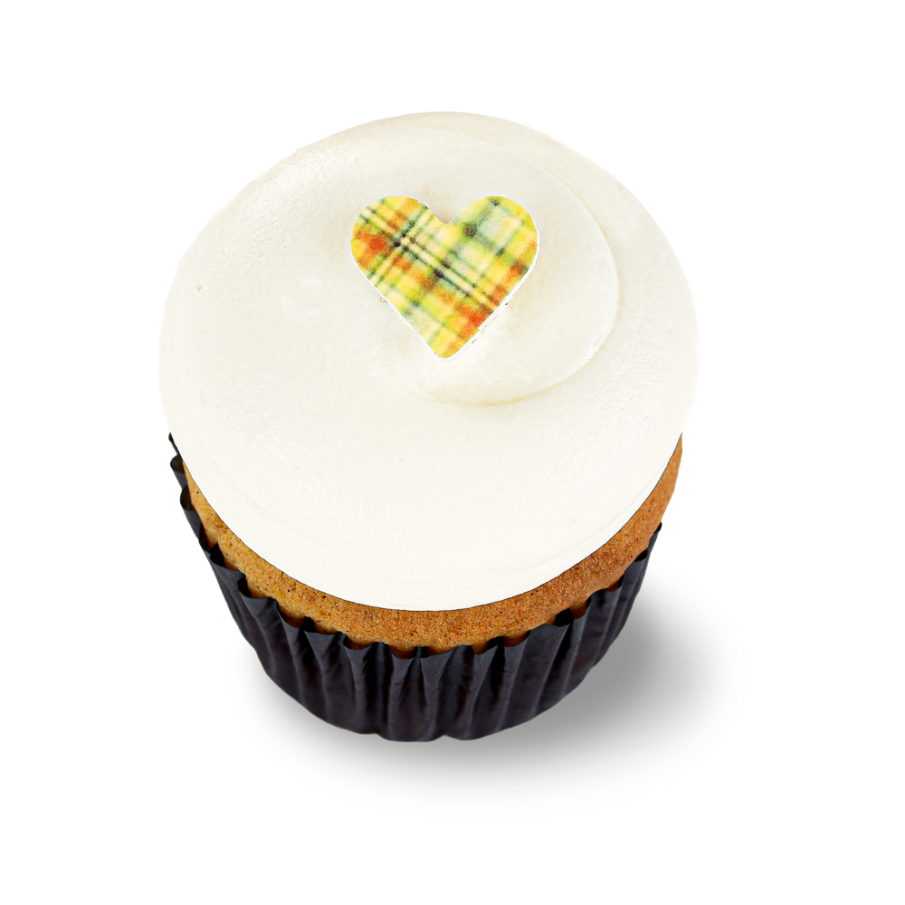 Pumpkin cupcake with marshmallow frosting and heart