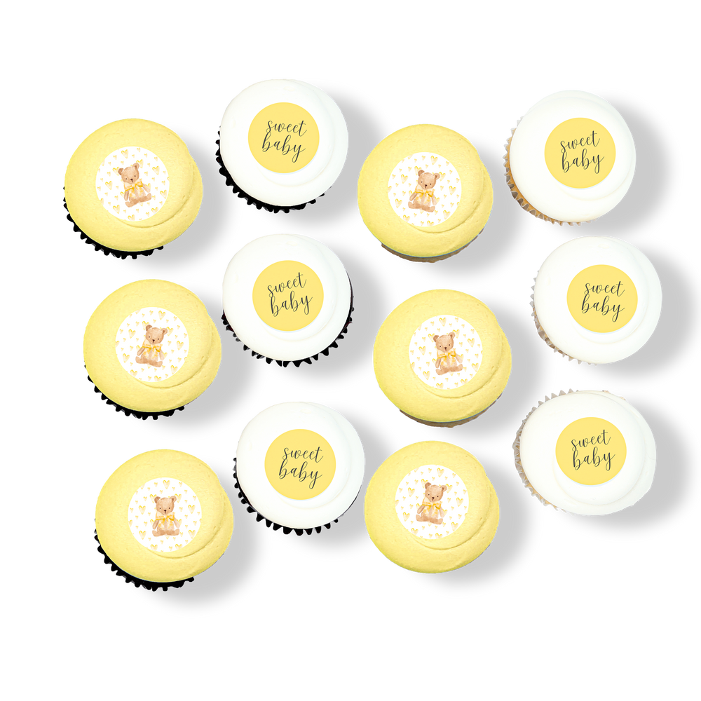 Baby-themed cupcakes with teddy bears and “Sweet Baby” toppers