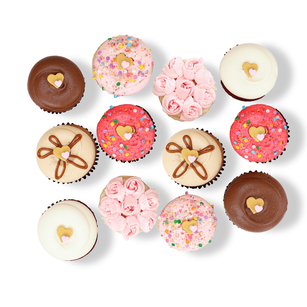 Celebration cupcakes with pink and chocolate frosting, sprinkles, and gold hearts