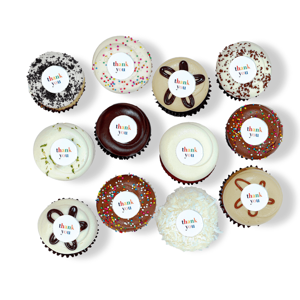 Cupcakes with chocolate and vanilla frosting and “thank you” fondant discs