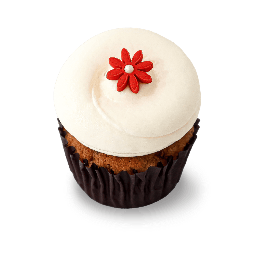 Vegan cupcake with cream cheese frosting and red flower