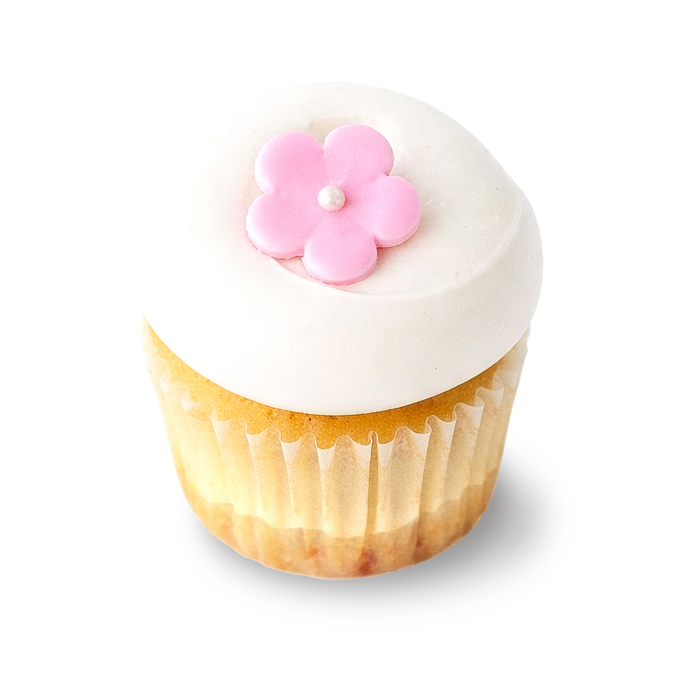 Cherry cheesecake cupcake with white frosting and flower