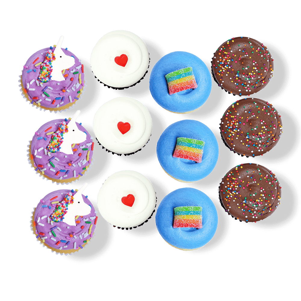 Christmas cupcakes with unicorn decorations, rainbow candy, and sprinkles