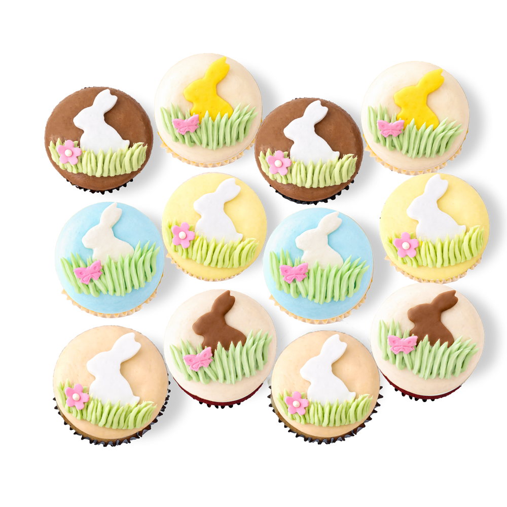 Spring cupcakes with bunny, grass, and flower designs