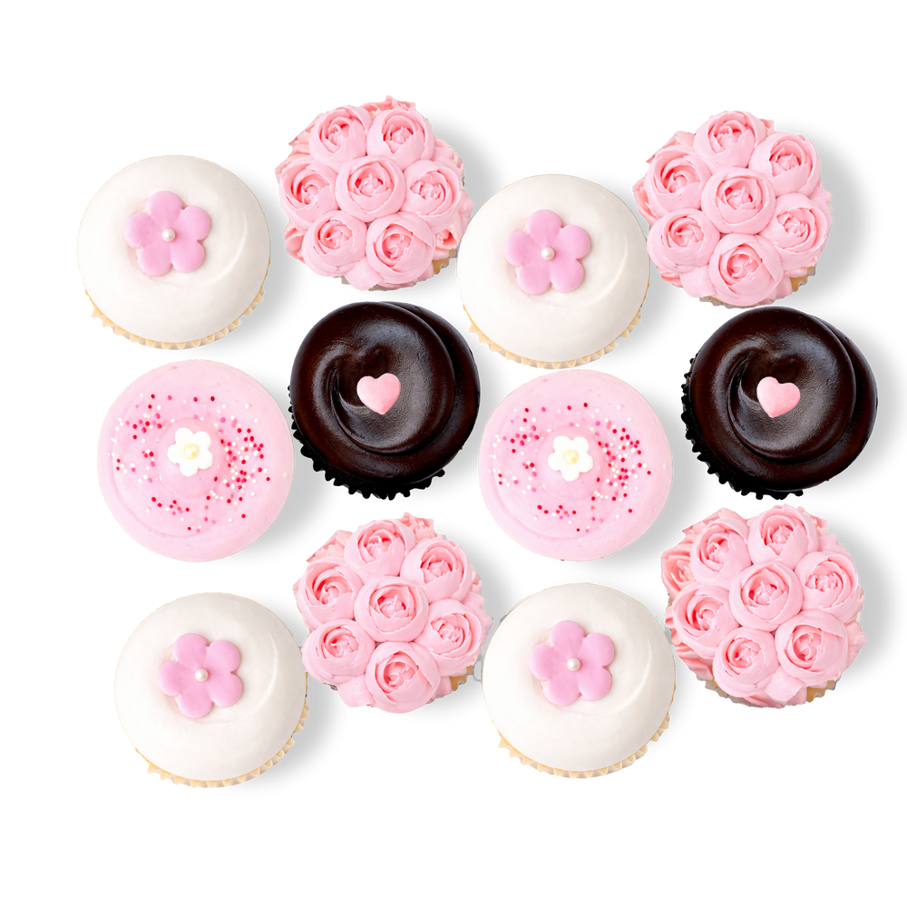 Spring cupcakes with cherry blossom-inspired pink flowers