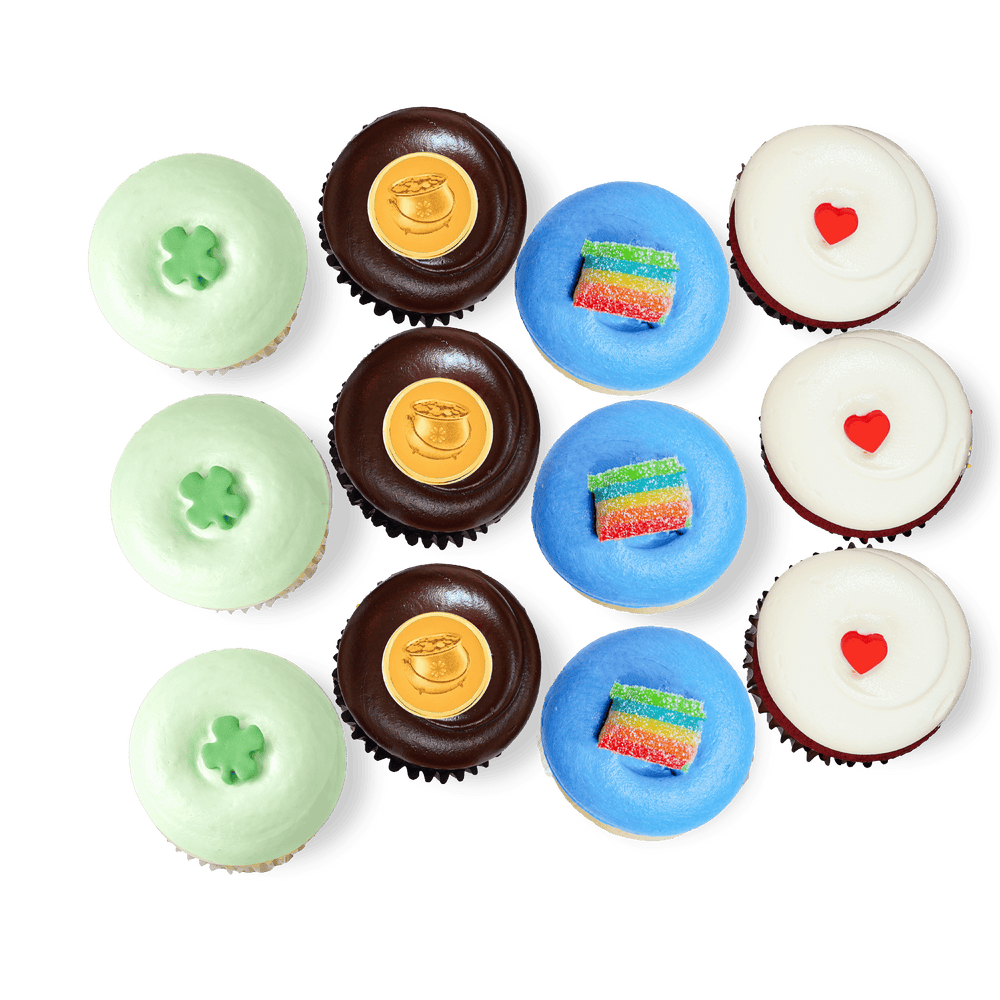 St. Patrick’s Day cupcakes with shamrocks, rainbow candy, and gold pot
