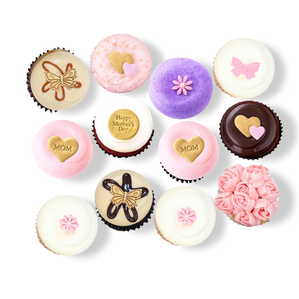 Mother’s Day cupcakes with pink and gold “Mom” toppers and flowers